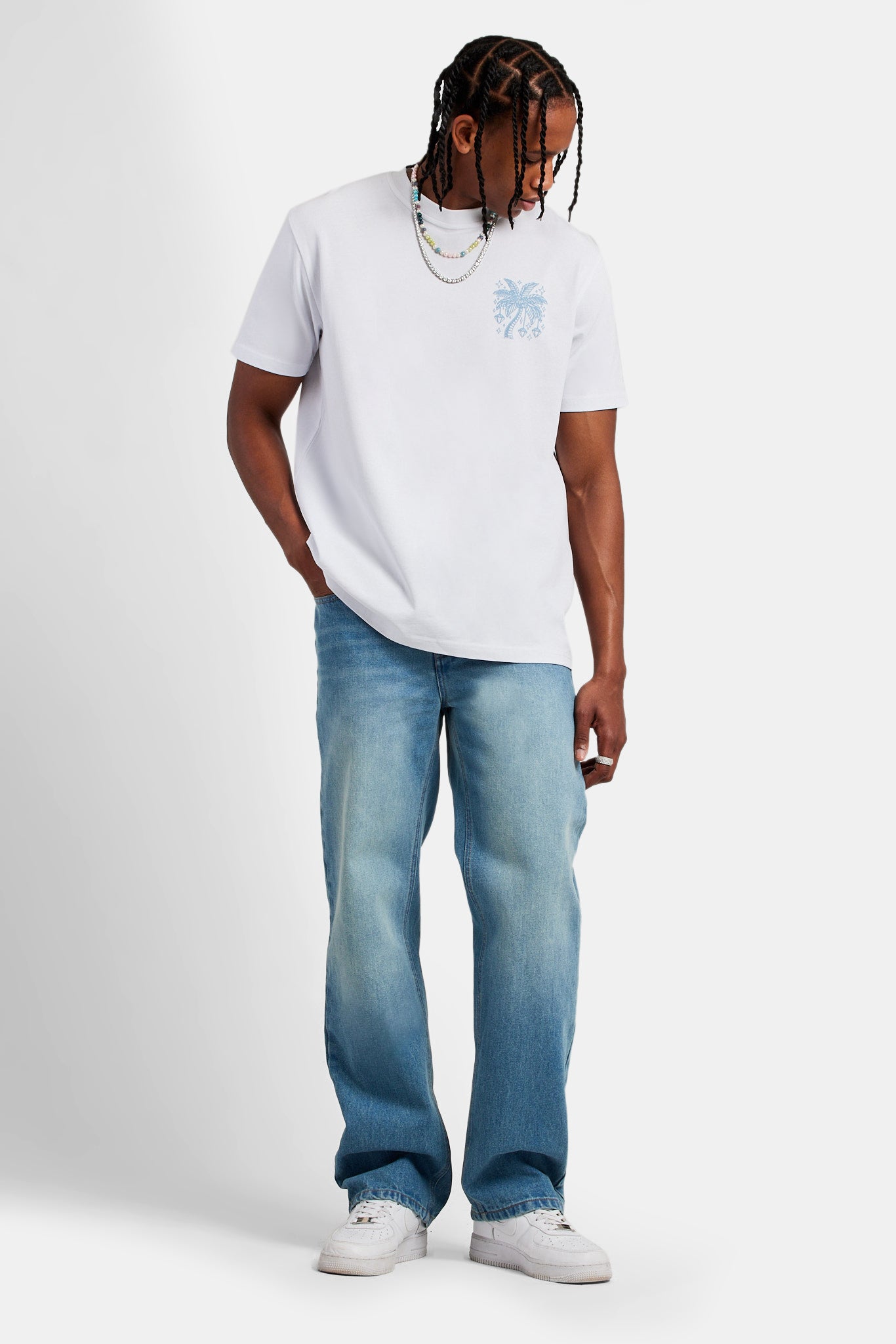 Male model wearing Diamond palm outline T-shirt in White